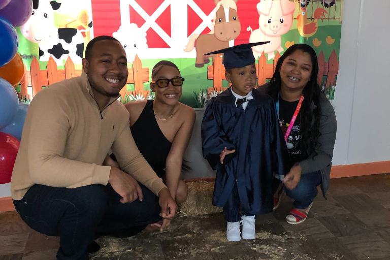 Early Head Start graduate Ronald with his mom, dad, and Early Head Start teacher